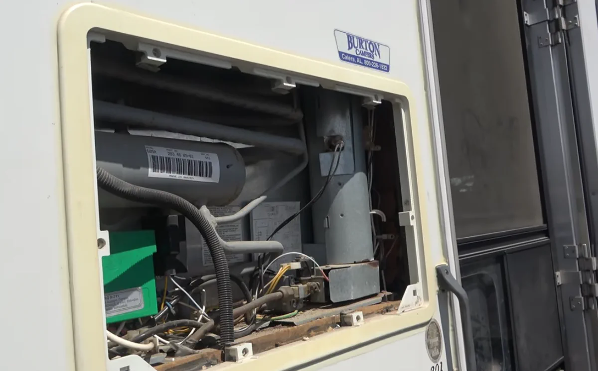Central Florida residential-fridge swap on a Class A coach at Disney's Fort Wilderness