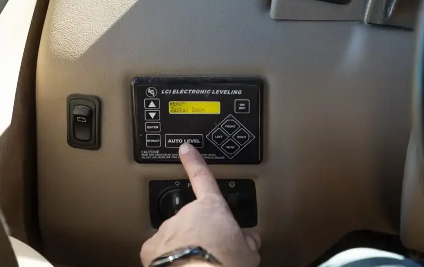 Manual scissor jack swap on a travel trailer rear corner