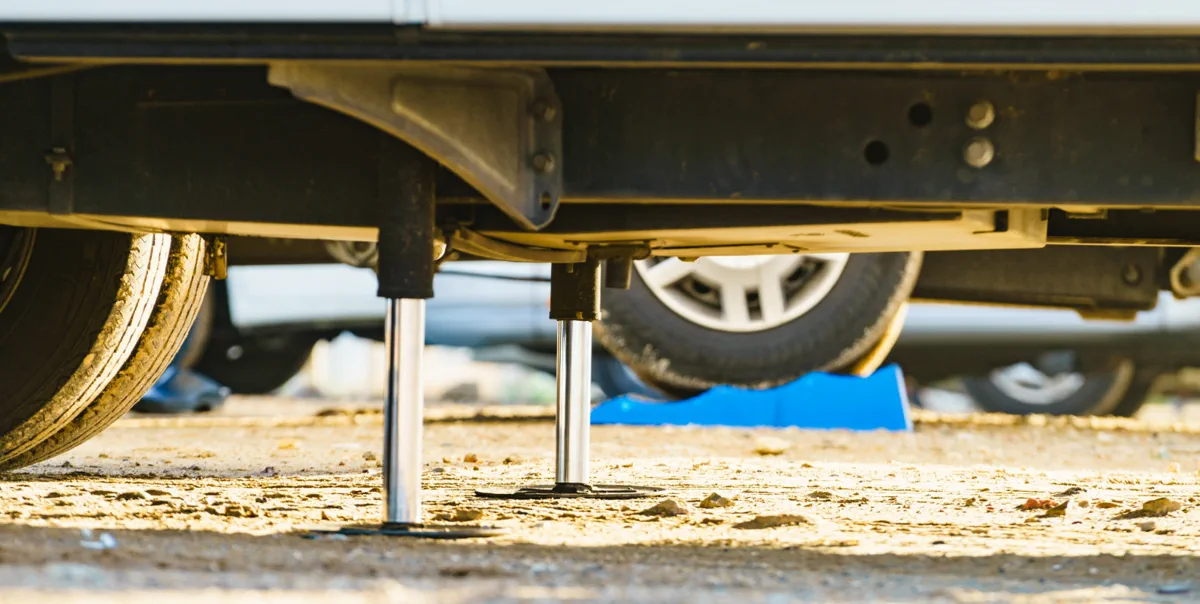 Lippert pin-box bushing rebuild on a fifth-wheel toy hauler in a Choctaw private driveway
