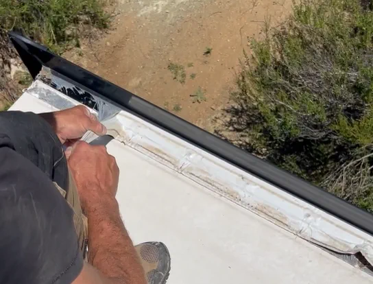 A1 RV Repair NRVIA-certified tech performing a roof substrate sounding inspection